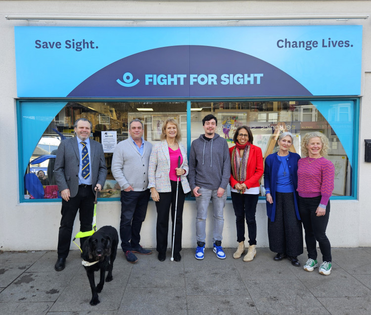 (Left to right) Keith Valentine, CEO and guide dog Dottie, Phil Beavan, Head of Retail, Heather Giles, Chair of Trustees, Arnold Khelifi, Shop Manager, Munira Wilson, MP, volunteers Christine and Deborah (credit: Fight for Sight).