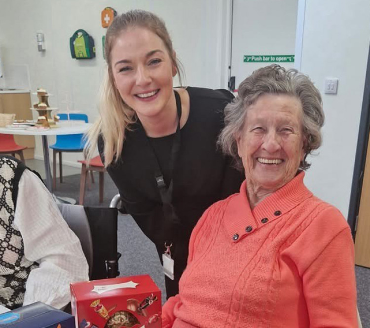 Lauren Edmunds from Balfour Beatty with tea party guest Iris Sykes.