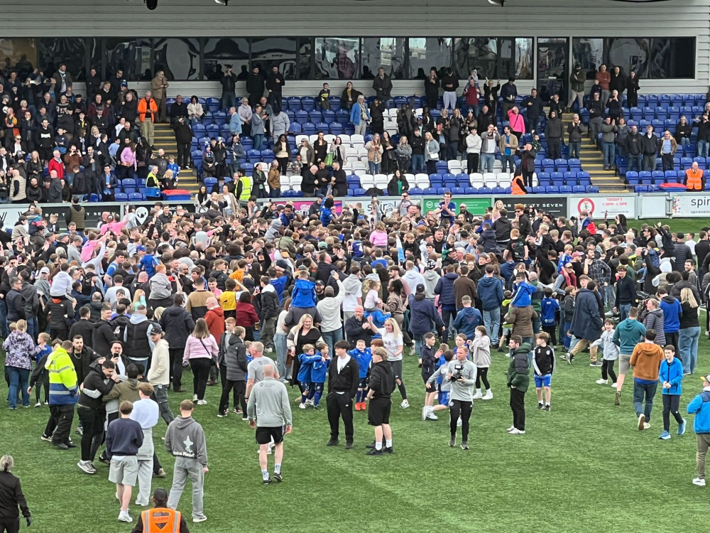 Pitch invasion as Macclesfield FC celebrate winning the league (Credit: Nub News)