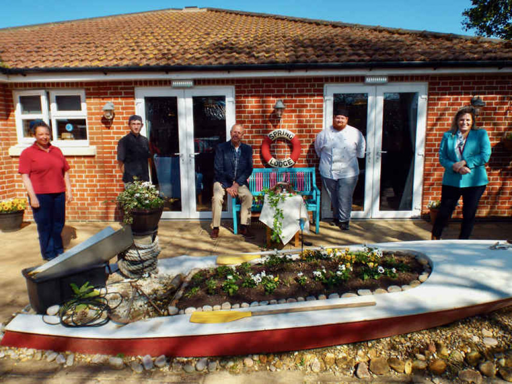 Spring Lodge's Aimee Davey, Tom Powell, Andy Gray and Donna Powell present cake to Felixstowe Radio's Rob Dunger