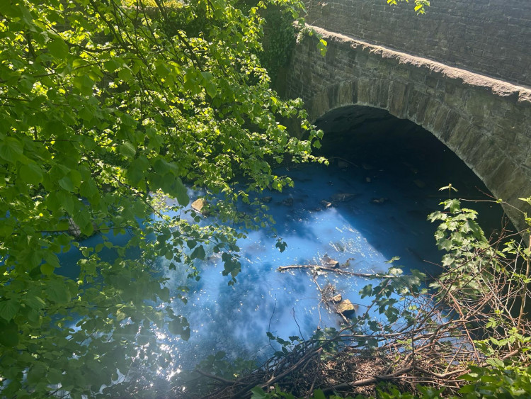 The River Dean was turned bright blue on Thursday (Credit: Nub News)