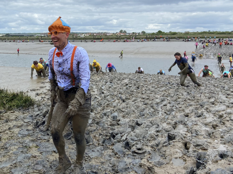 Participants clamber to the finish at Maldon Mud Race 2025. (Credit: Chloe Brewster)