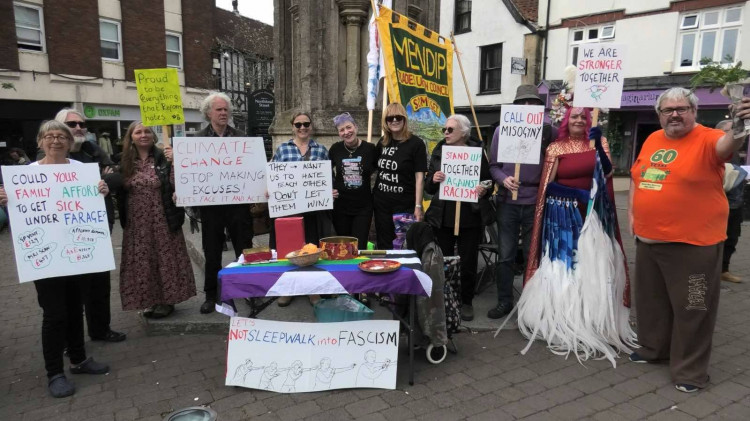A Glastonbury rally against hate was disrupted by a man making Nazi salutes; the crowd's unified response highlighted community solidarity.