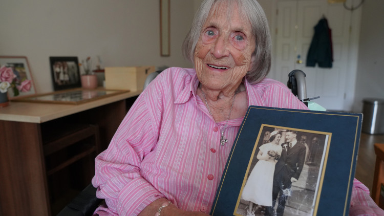 Rita, with her wedding photo (credit: Royal Star & Garter).