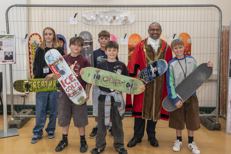 The new Mayor Of Wells, Cllr Louis Agabani with a group of young skaters involved with The Wells Skatepark Project