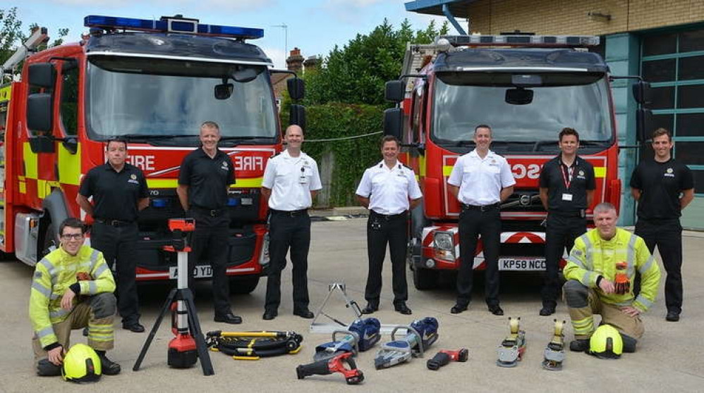 Suffolk firefighters with new green rescue vehicles