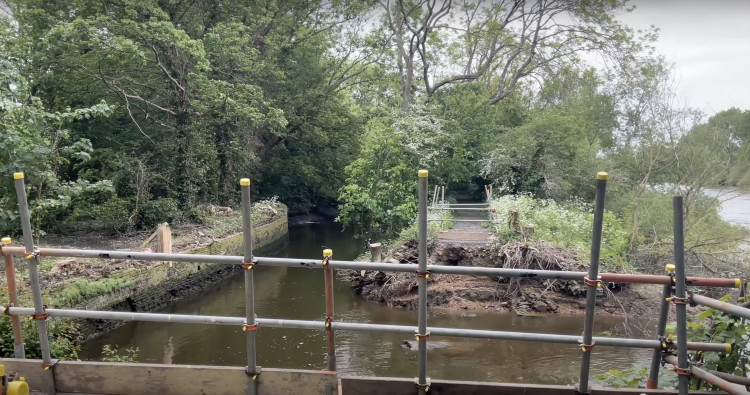 Work underway to restore the collapsed Thames towpath near Richmond Lock, with permanent repairs set for completion this summer (credit: Richmond Council/YouTube).