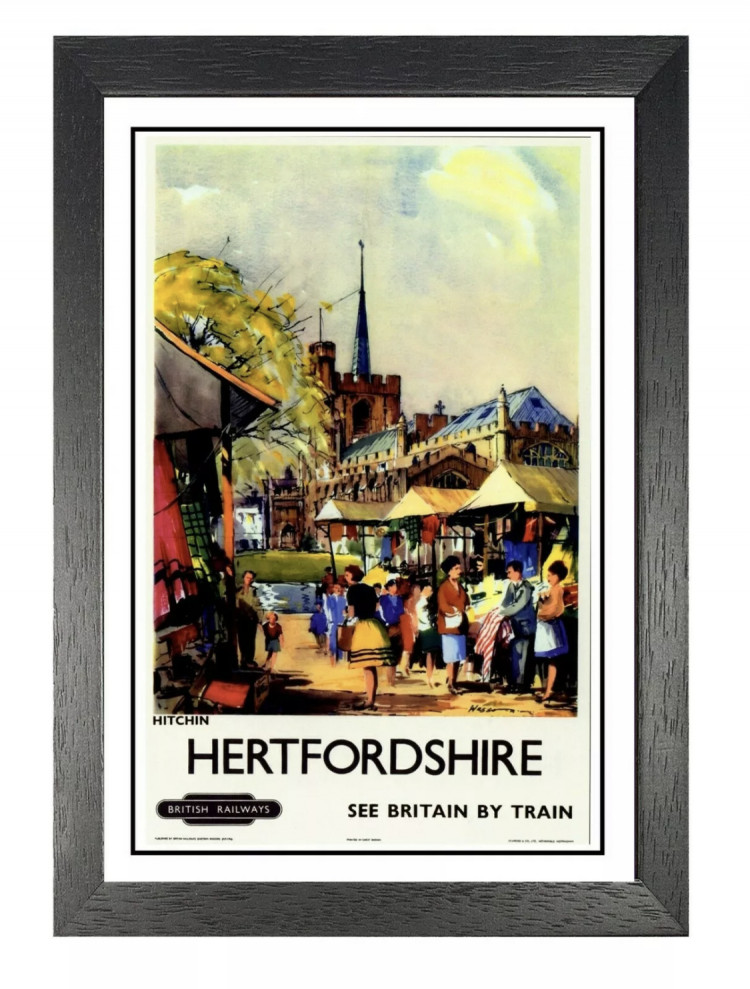A classic poster promotes visiting Hitchin by train 