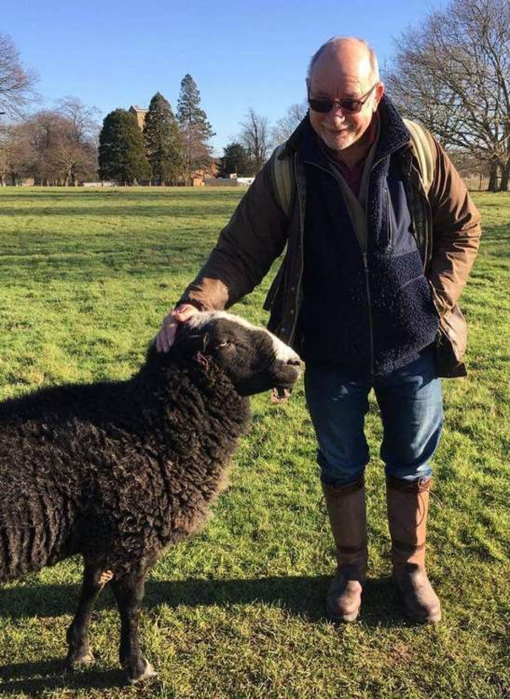 Former teacher Simon Pearce with one of the sheep in Woolverstone school's grounds (Picture credit: Simon Pearce)