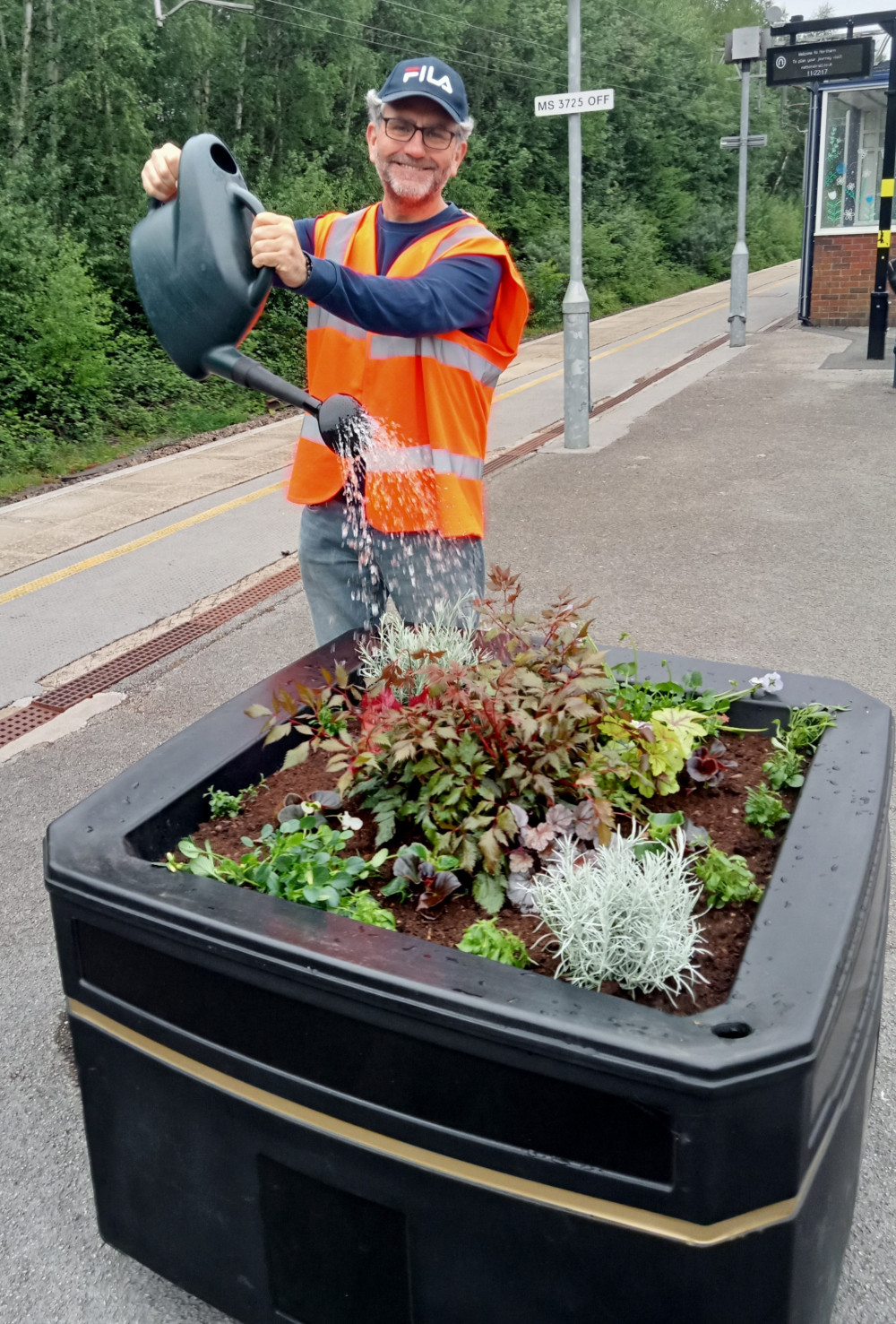 FOSS chairman, Christian Shawcross, watering the new planter on Platform 2. (Photo: Friends of Sandbach Station) FOSS chairman, Christian Shawcross, watering the new planter on Platform 2. (Photo: Friends of Sandbach Station)
