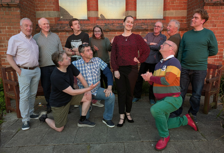 Chester Operatic Society's Louise Ellinson as 'The Merry Widow', surrounded by her admirers (Image via: Pauline Morton)