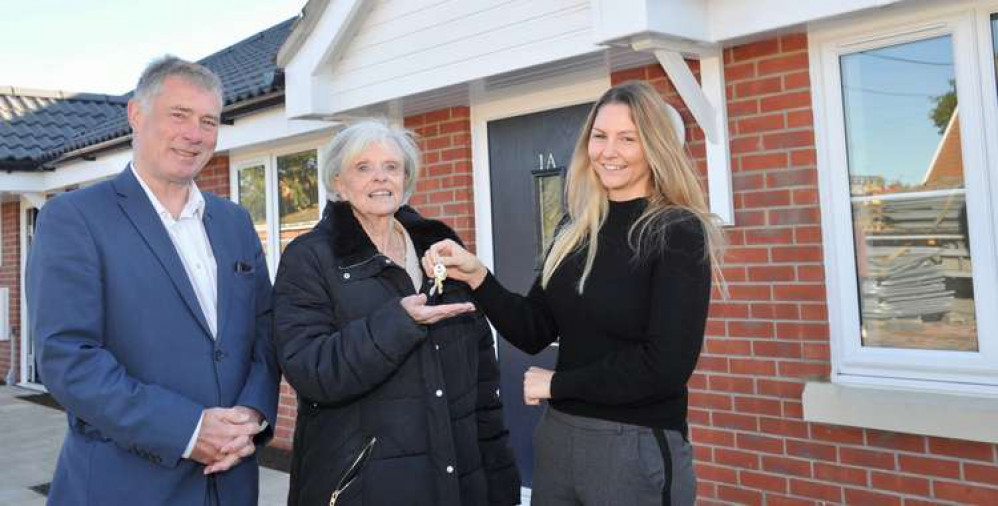 Cllrs Derek Davis and Jan Osborn take keys from Sarah Evans of DHC Construction (Picture credit: Lucy Taylor)