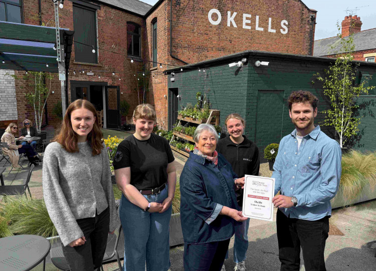 Christine Russell Chair of Chester Civic Trust presents the Judges Award for 2025 to Okells Hoole (Image via: Chester Civic Trust)