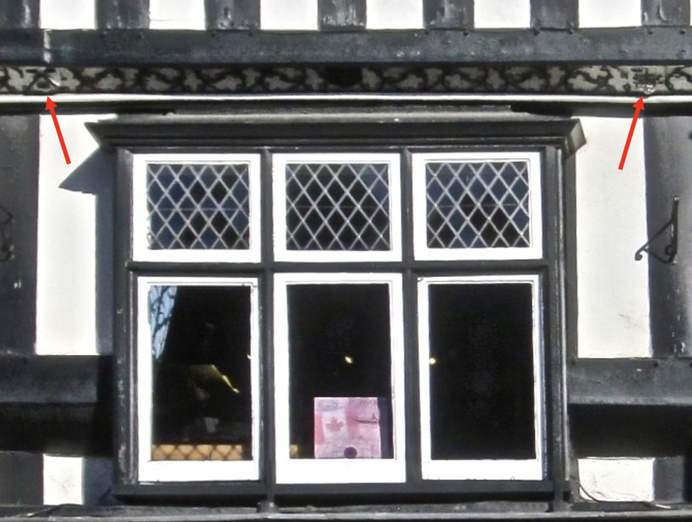 Shields above first floor window Shields above first floor window