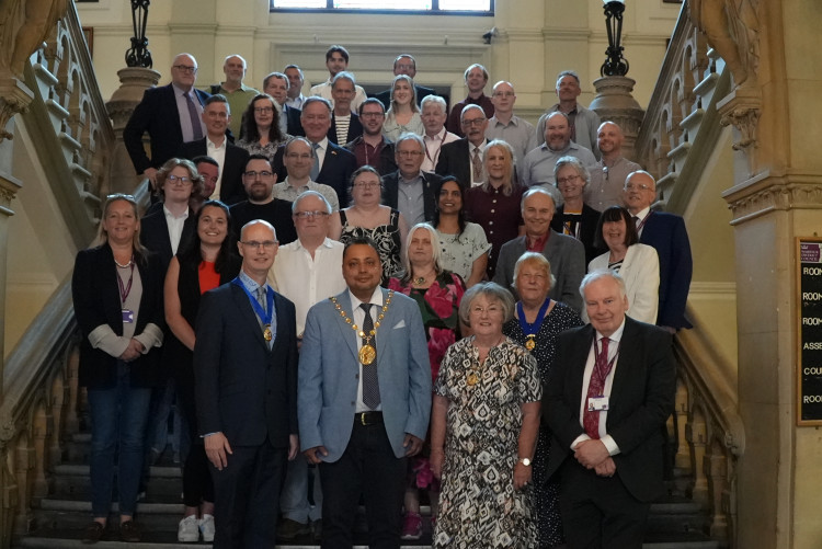 Warwick District Councillors on the stairs in the Town Hall (images supplied)