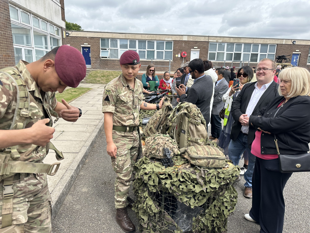 A Gurkha soldier demonstrates his battle dress to Mayor Sue Shinnick