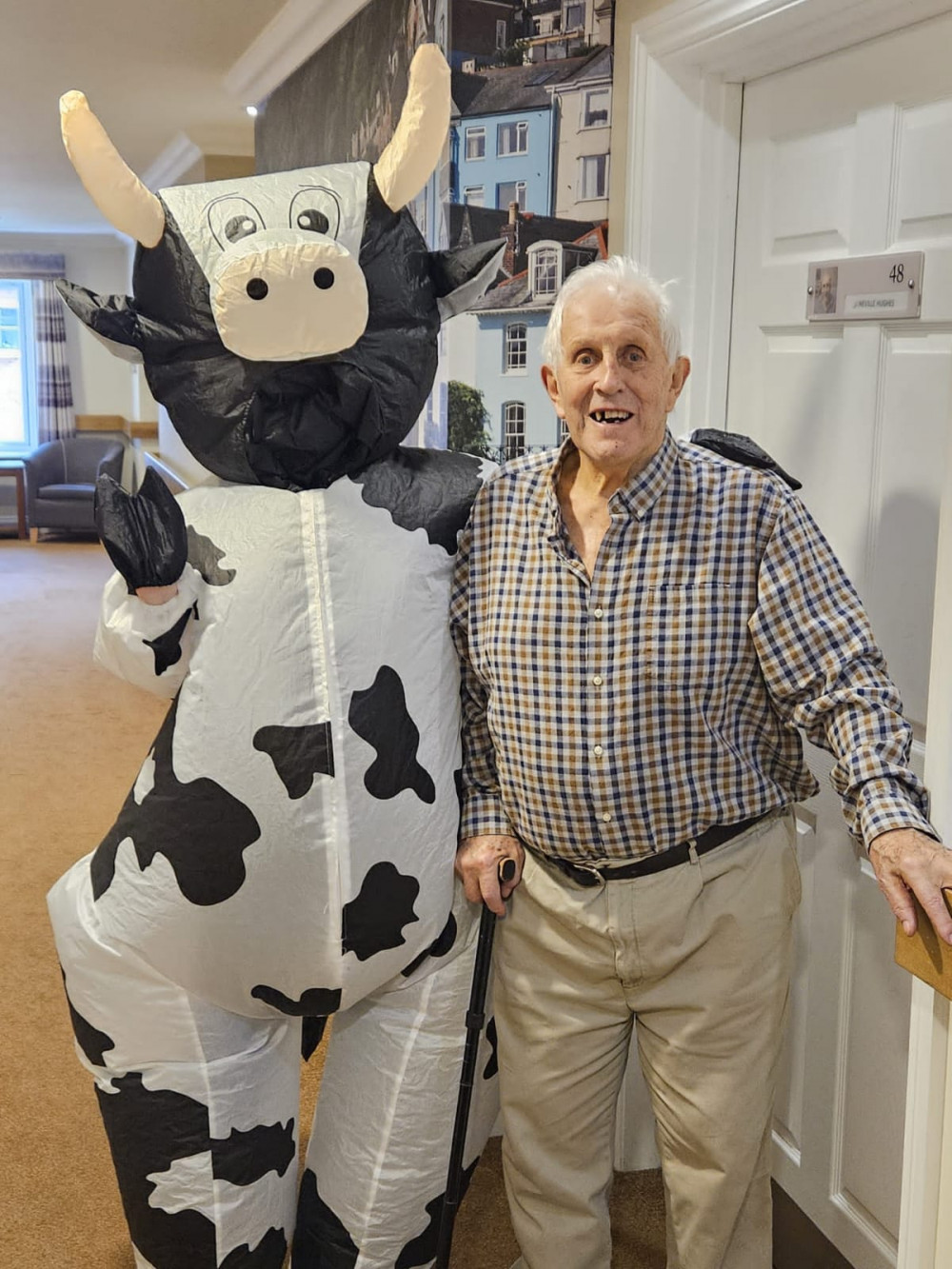 Crandon Springs resident and former Somerset farmer, Neville, wanted to see a cow, so care worker Mia made his wish come true by dressing in an inflatable cow suit! Crandon Springs resident and former Somerset farmer, Neville, wanted to see a cow, so care worker Mia made his wish come true by dressing in an inflatable cow suit!