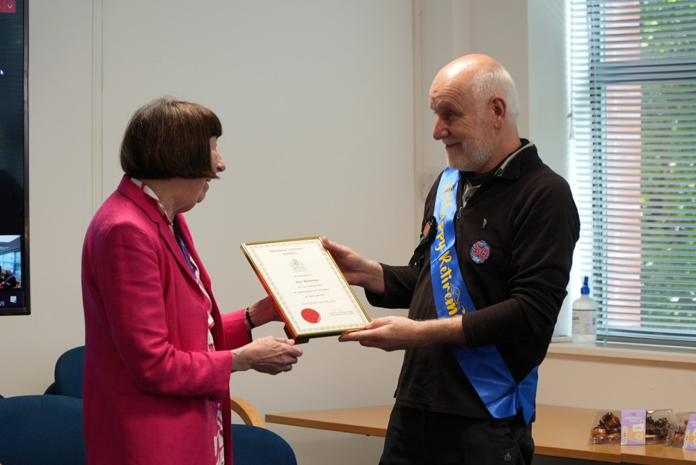 Jon Holmes is presented with his Long Service Award from Councillor Sidney Syson (image via Warwick District Council) Jon Holmes is presented with his Long Service Award from Councillor Sidney Syson (image via Warwick District Council)