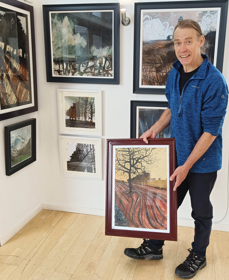 Artist, Ian Pearsall, at his exhibition. (Photo: Two Doors Studio)