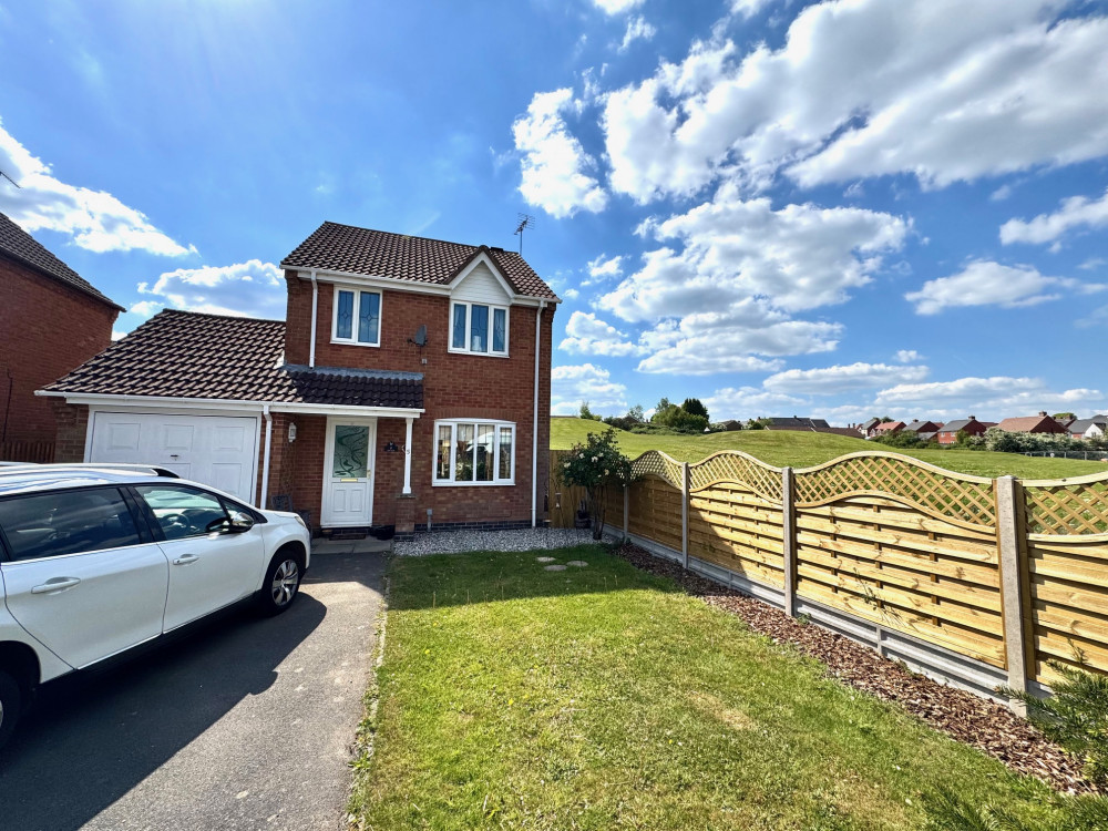 The property features off-road parking, a garage, and a lovely private garden, ideal for outdoor relaxation. Photos: Reddington Homes The property features off-road parking, a garage, and a lovely private garden, ideal for outdoor relaxation. Photos: Reddington Homes