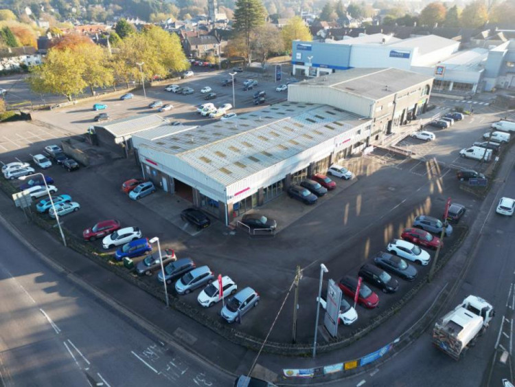 Somerset Council reviews a proposal to demolish a two-storey extension at the old Honda garage for expanded parking and future tenant flexibility.