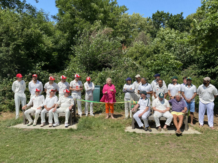 Founder Lynn Page (centre) cutting the ribbon to unveil the benches on the day BCCC played St.Tropez Cricket Club (credit: Barnes Common).