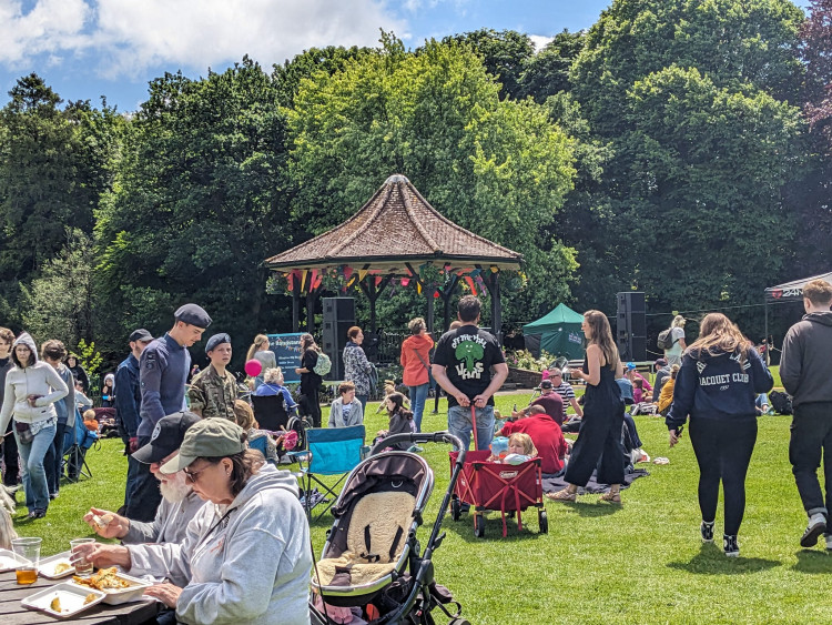 Crowds enjoying a previous Collett Park Day in Shepton Mallet, with live music, food stalls and family entertainment throughout the park.