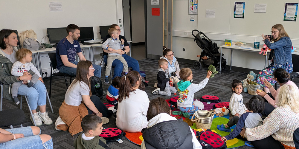 Parents, carers and children at one of the play workshops. Parents, carers and children at one of the play workshops.