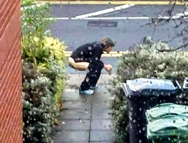 Ricky Dwyer, 37, of Bateman Close, had gotten out of the bath and got dressed on Saturday 14 June to see the unknown male squeezing to take a dump on his front garden path (Supplied).