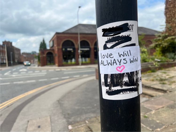 Police are investigating 'highly offensive' posters spotted around Macclesfield. Many of them have since been taken down or covered up (Credit: Nub News)