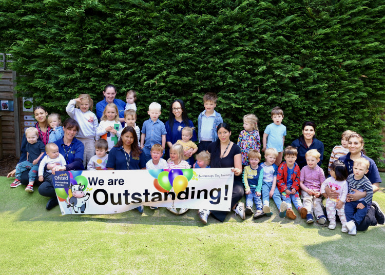 Buttercups Teddington staff and children celebrating their 'Outstanding' tarting (Image supplied)