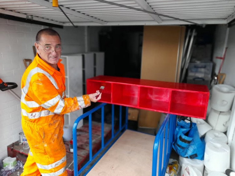 Councillor Malcolm Phillips busy with the paint brush