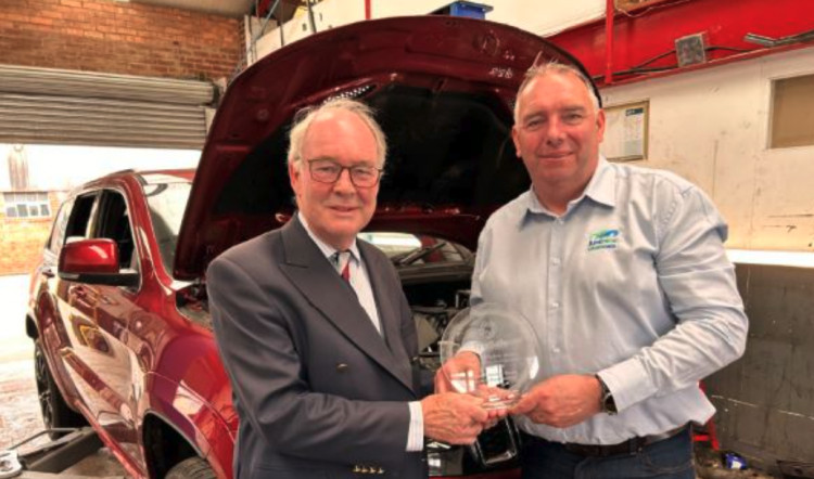  Chair of Warwickshire Road Safety Partnership Philip Seccombe celebrates the TyreSafe award with Carl Jay, owner of Just Nice Clean Cars based in Warwick, which was one of the garages to take part in the ‘Garage Anxiety’ initiative.