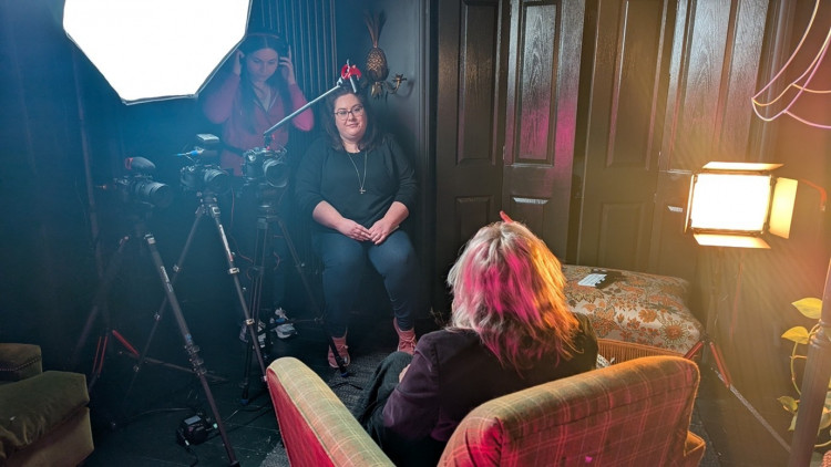 Camera operator, Leah Martin and director Natalie Scarsbrook interview Syd Moore.