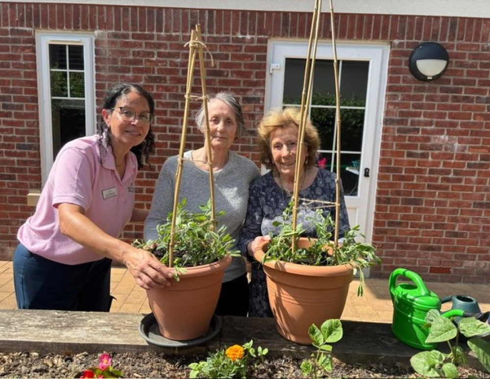 Emily, with Crandon Springs residents Sue and Rose, and their sweet peas. Emily, with Crandon Springs residents Sue and Rose, and their sweet peas.