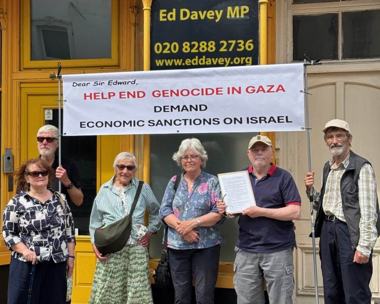 Local residents gathered outside Ed Davey's Surbiton constituency office on calling for urgent action to oppose Israel’s ongoing assault on Gaza (Credit: Paul Tippell)