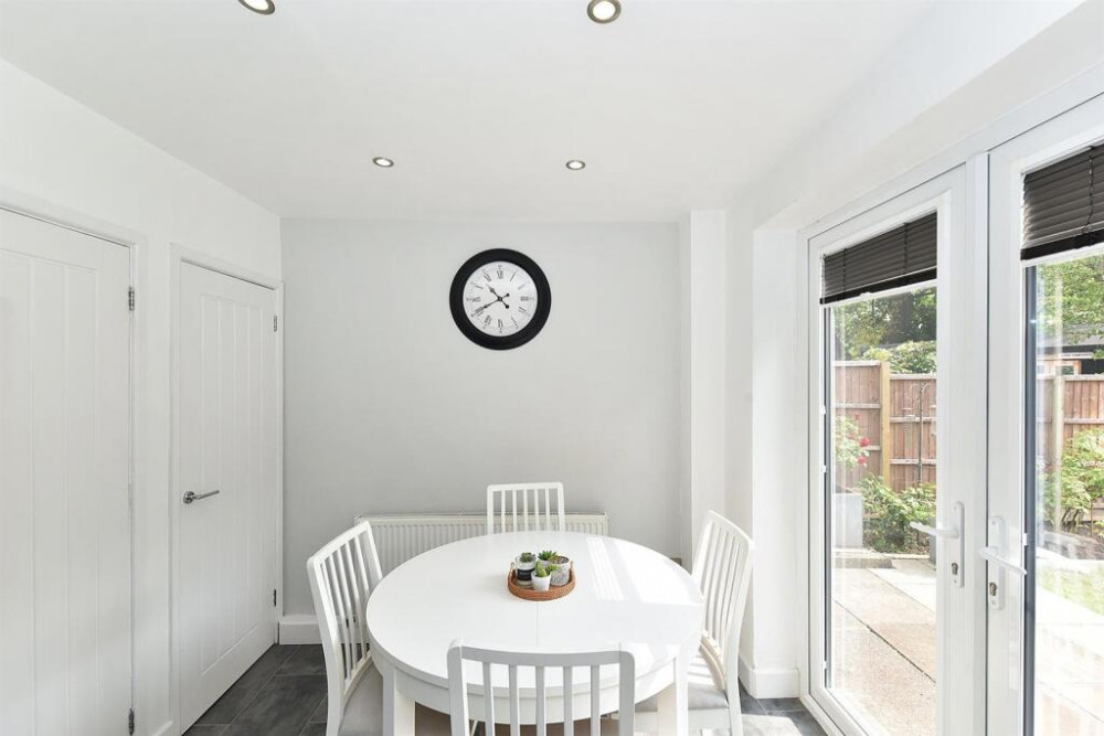Dining area and doors leading to the back garden (Credit: Holden & Prescott) Dining area and doors leading to the back garden (Credit: Holden & Prescott)