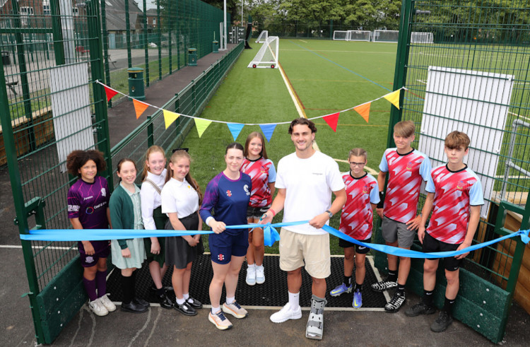 England centre-back Taylor Harwood-Bellis visited Stockport School to open a new 3G football pitch (Image - Stockport Council)