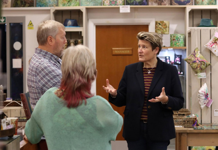 Lib Dem MP Sarah Dyke talking to business owners in Glastonbury (Photo: Lib Dems)