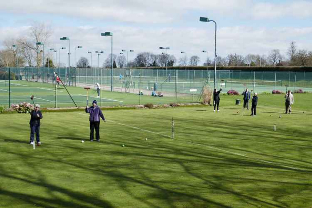 Players enjoying croquet on the first day of play since lockdown