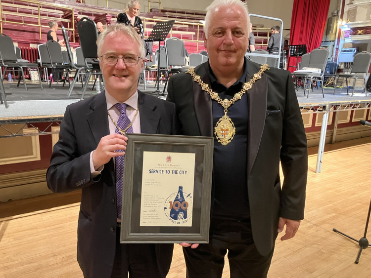Cllr Sam Corcoran (Left) receiving the certificate from the Lord Mayor of Stoke. (Photo:  The North Staffordshire Symphony Orchestra)   