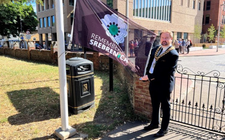 A previous mayor, Cllr James Halden, with the Srebrenica flag.
