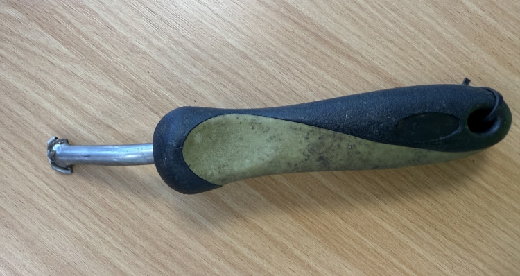 This 'adapted' garden tool was discovered during a sweep the day after the incident (Credit: Cheshire Police)
