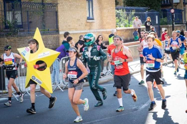 George Crawford completed the marathon in an Aston Martin Formula 1 outfit as he raised money for MIND (Image via Kenilworth Runners)