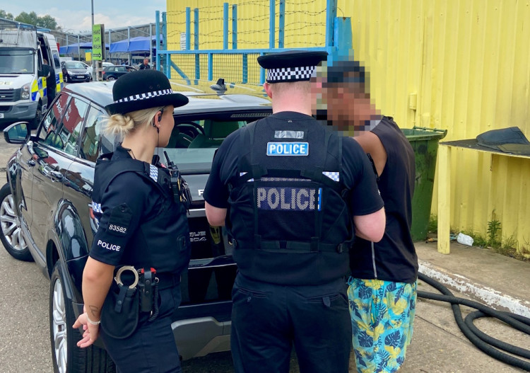 A man shares his legal documents with officers. (Credit: Essex Police)