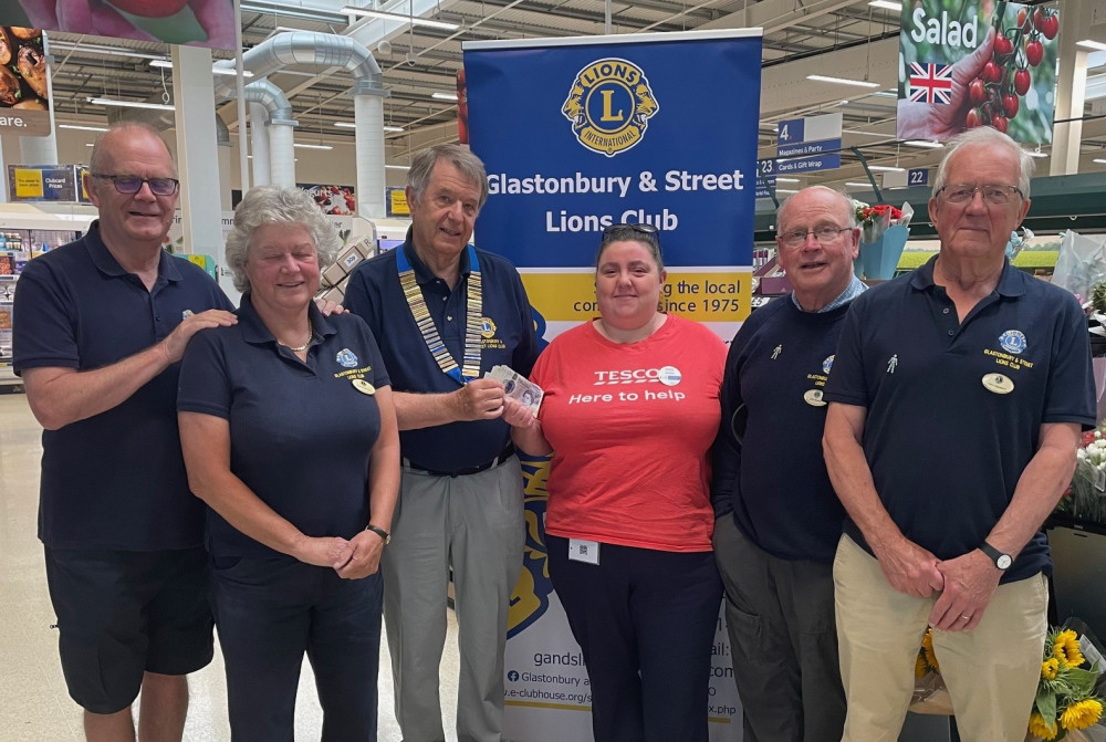 Tesco customers in Glastonbury have proved that second-hand stories can still do a world of good – raising £250 for the Glastonbury and Street Lions Club just by picking up a paperback. The donation comes from the store’s in-store second-hand book shelves, which allow customers to grab a read in exchange for a small donation. June’s takings have now been handed over to the Lions and will go straight into the club’s charity account to support a wide range of good causes. Lions members dropped by the store to collect the donation and meet Tesco’s Community Champion, Kristie Mynott, who presented the cheque to incoming club president Peter Cole. A spokesperson for the Lions said: “We’re most grateful to Tesco for the donation. This is a great example of recycling books and giving a benefit to those less fortunate than ourselves.” The funds will go toward the club’s ongoing support for local, national and international projects, continuing a long tradition of fundraising and community service across Glastonbury, Street and the surrounding villages. The Lions Club recently marked the start of its new year, with Peter Cole taking over the chain of office – and preparing to lead the club into its 50th anniversary celebrations in 2026. In the meantime, it’s clear that every donated book – no matter how dog-eared – still has a chapter to write. (Supplied) Tesco customers in Glastonbury have proved that second-hand stories can still do a world of good – raising £250 for the Glastonbury and Street Lions Club just by picking up a paperback. The donation comes from the store’s in-store second-hand book shelves, which allow customers to grab a read in exchange for a small donation. June’s takings have now been handed over to the Lions and will go straight into the club’s charity account to support a wide range of good causes. Lions members dropped by the store to collect the donation and meet Tesco’s Community Champion, Kristie Mynott, who presented the cheque to incoming club president Peter Cole. A spokesperson for the Lions said: “We’re most grateful to Tesco for the donation. This is a great example of recycling books and giving a benefit to those less fortunate than ourselves.” The funds will go toward the club’s ongoing support for local, national and international projects, continuing a long tradition of fundraising and community service across Glastonbury, Street and the surrounding villages. The Lions Club recently marked the start of its new year, with Peter Cole taking over the chain of office – and preparing to lead the club into its 50th anniversary celebrations in 2026. In the meantime, it’s clear that every donated book – no matter how dog-eared – still has a chapter to write. (Supplied)