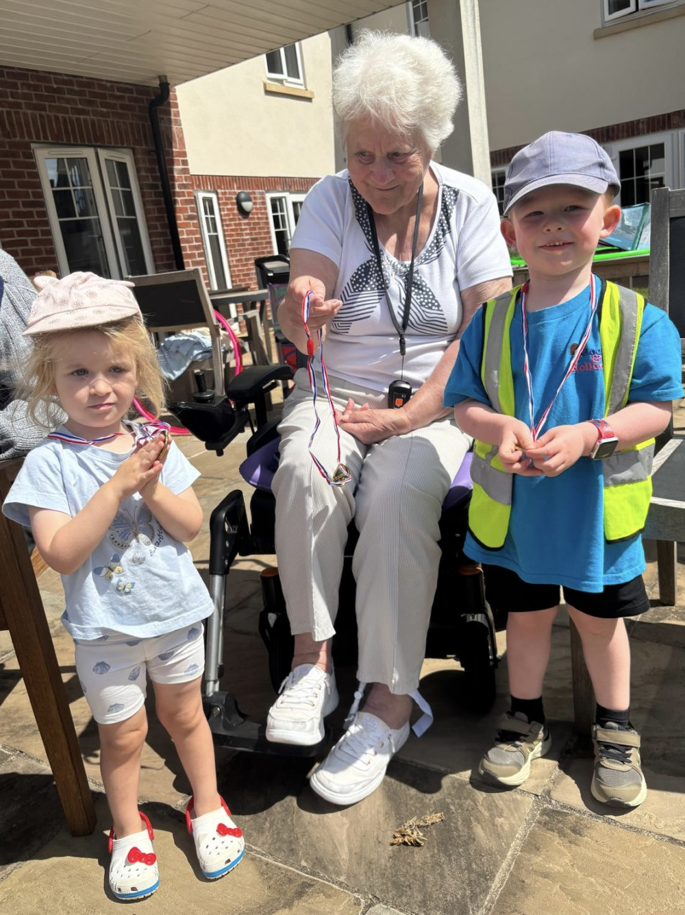Crandon Springs Care Home residents were delighted to present medals to all the nursery children at the end of the sports day. Crandon Springs Care Home residents were delighted to present medals to all the nursery children at the end of the sports day.