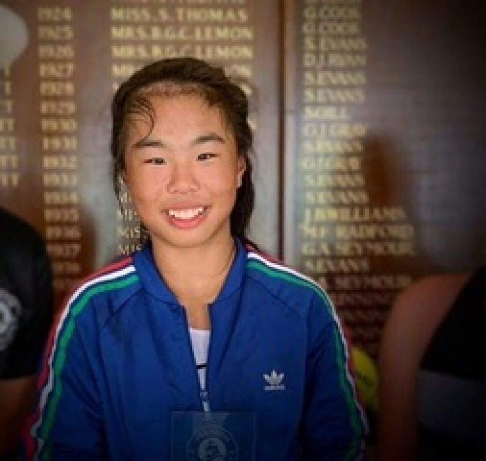Mimi Xu in front of the champions board at Penarth Lawn Tennis Cub aged 11 in 2019 Mimi Xu in front of the champions board at Penarth Lawn Tennis Cub aged 11 in 2019