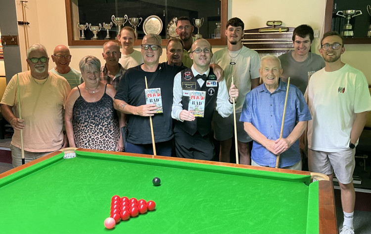 Members of Ivanhoe Social Club celebrate John Villiers and Daniel Blunn's sponsorship agreement