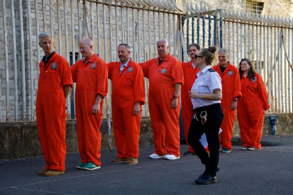 The group, dubbed “corporate convicts,” were “sentenced” for fictional crimes and given a serious task: to raise £800 in bail within 24 hours to secure their release (Photo: Dorset and Somerset Air Ambulance) The group, dubbed “corporate convicts,” were “sentenced” for fictional crimes and given a serious task: to raise £800 in bail within 24 hours to secure their release (Photo: Dorset and Somerset Air Ambulance)